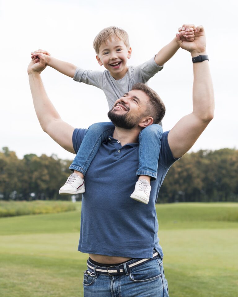 father-holding-his-son-his-shoulders-front-view